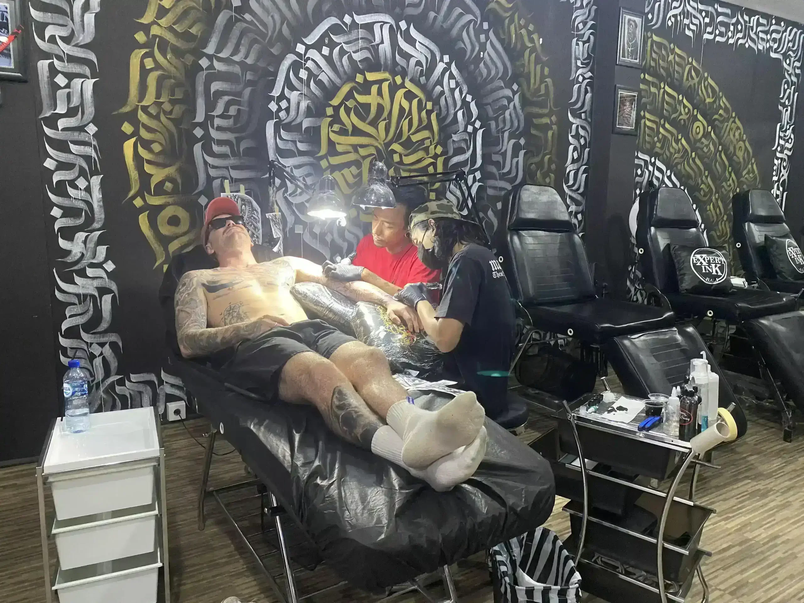 Expert Ink Tattoo Bali's best tattoo artist in Seminyak creating a beautiful tattoo for a customer.
