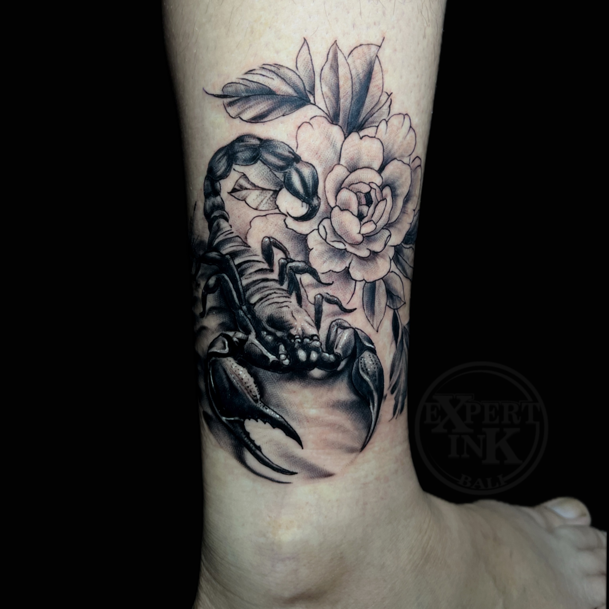 Flower tattoo on the Calf by Expert Ink Bali, showcasing intricate shading and fine detailing.